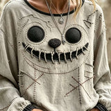 Noelle | Halloween-Inspired Beige Stitched Ghost Face Print Round Neck Long Sleeve Blouse